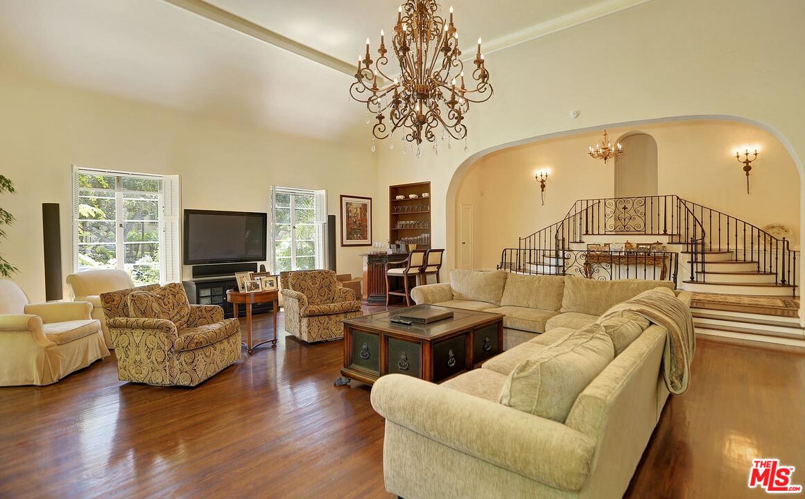 602 North Camden Drive Beverly Hills, CA 90210 - Photo 3 of 18 a living room with fireplace furniture and a flat screen tv