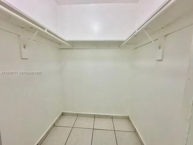 a kitchen with stainless steel appliances a stove a refrigerator and a sink