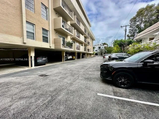 a view of a car parked in a yard