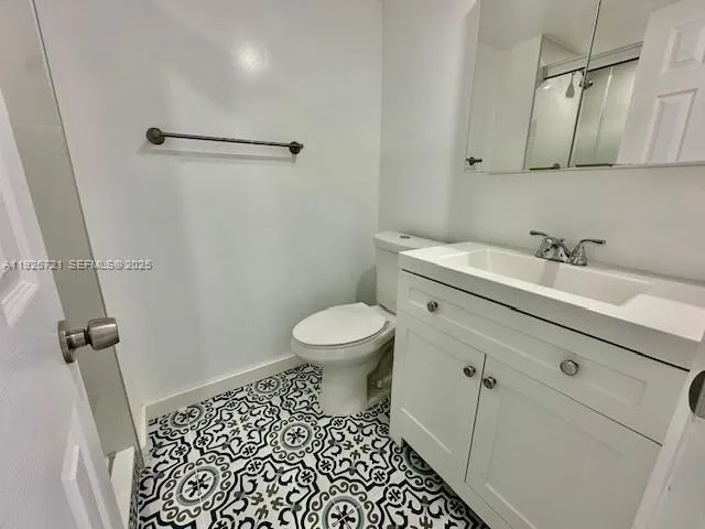 a bathroom with a shower and a mirror