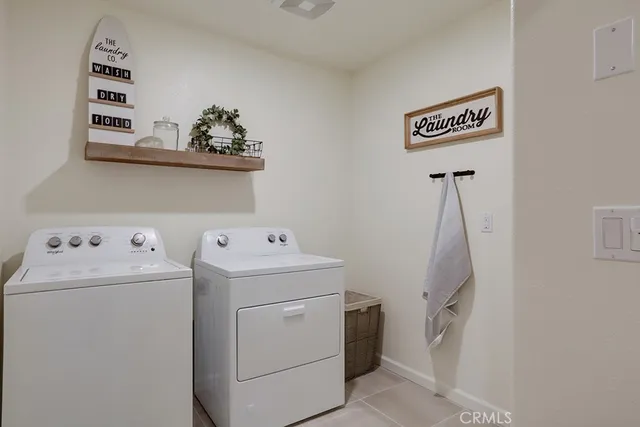 a view of storage and utility room with washer and dryer