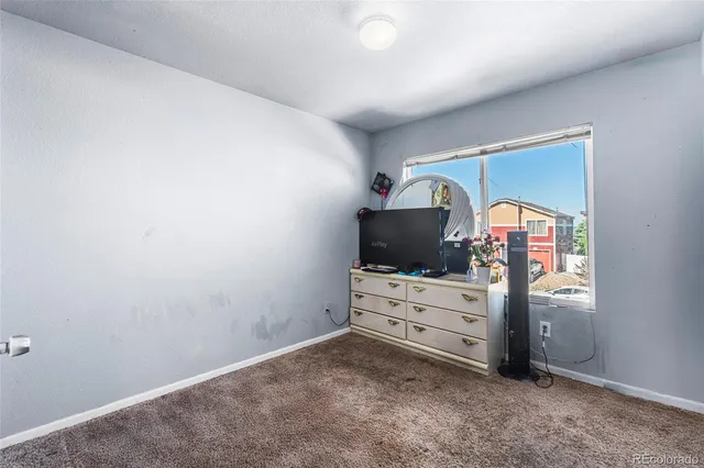 a room with furniture and flat screen tv