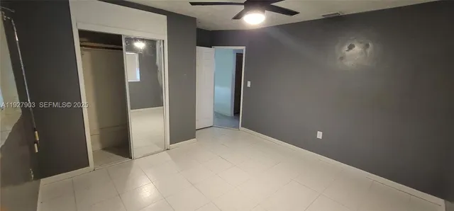 a room with a bed and furniture