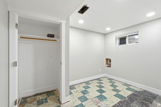 778 East 200 North Logan, UT 84321 - Photo 11 of 43 Interior room featuring a built-in closet with shelving, recessed ceiling lighting, and a window with blinds