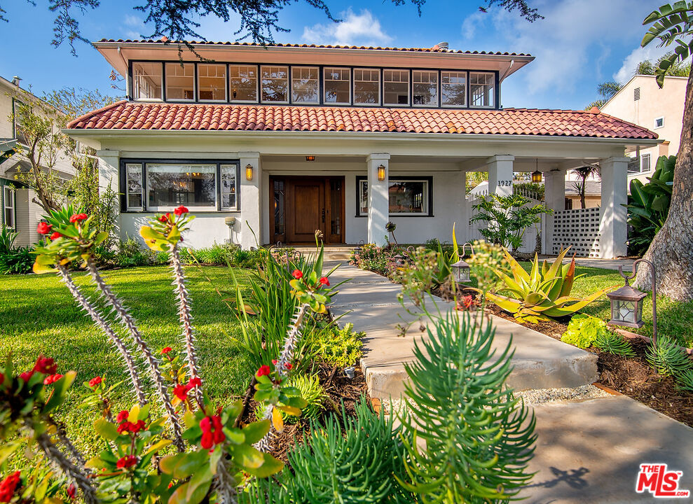 1927 Buckingham Road Los Angeles, CA 90016 - Photo 1 of 36 front view of a house with a patio
