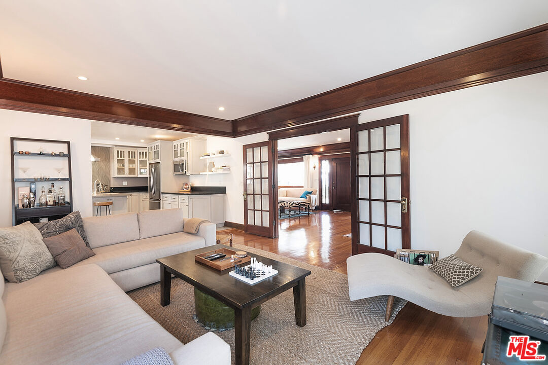 1927 Buckingham Road Los Angeles, CA 90016 - Photo 11 of 36 a living room with furniture and a large window