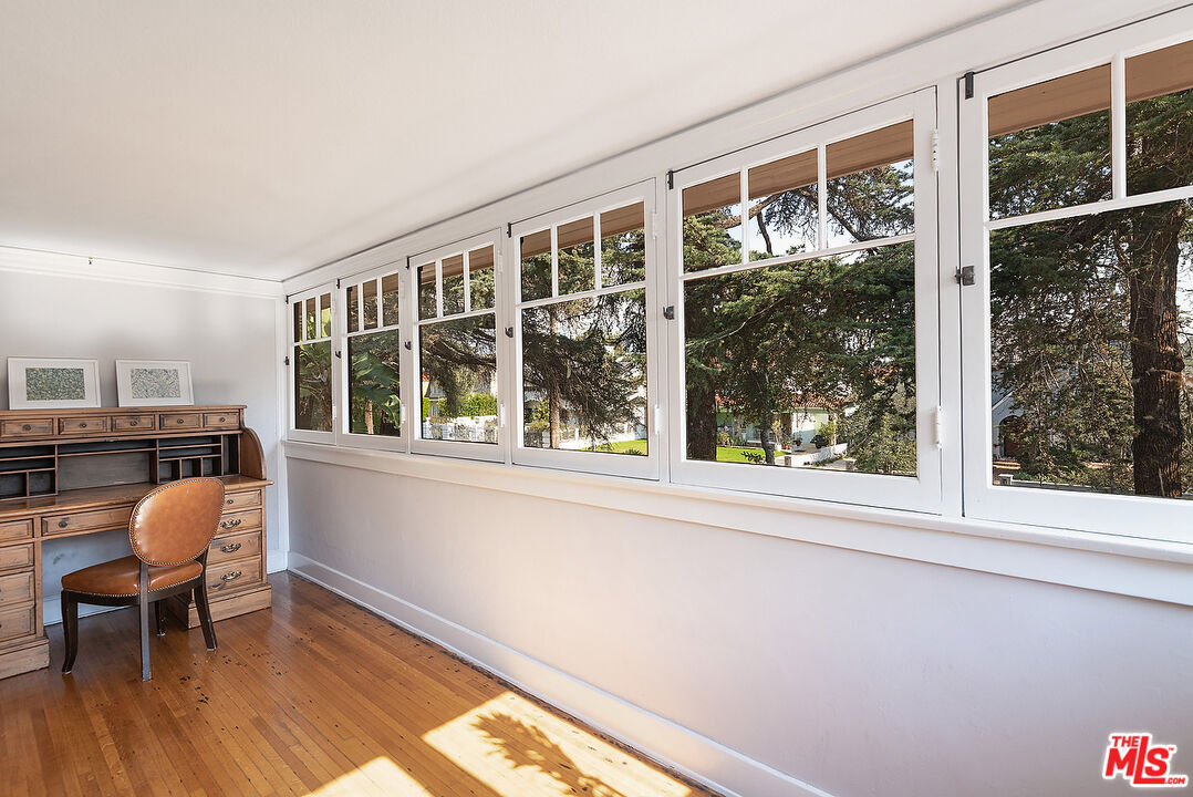 1927 Buckingham Road Los Angeles, CA 90016 - Photo 25 of 36 a view of a room with a window and wooden floor