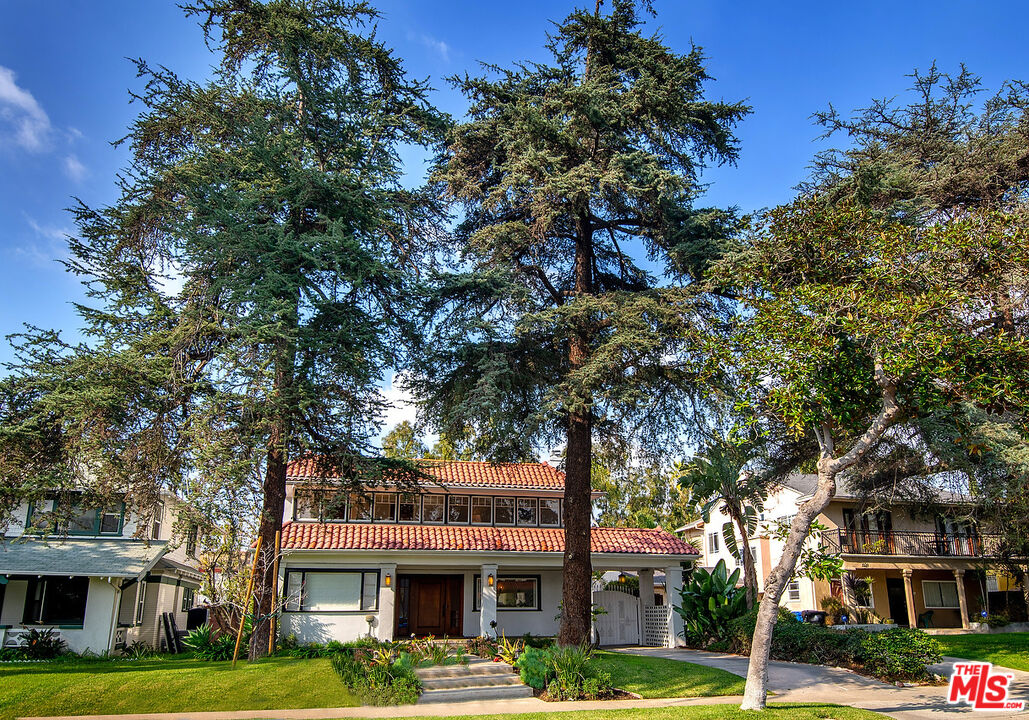 1927 Buckingham Road Los Angeles, CA 90016 - Photo 3 of 36 a front view of a building with trees