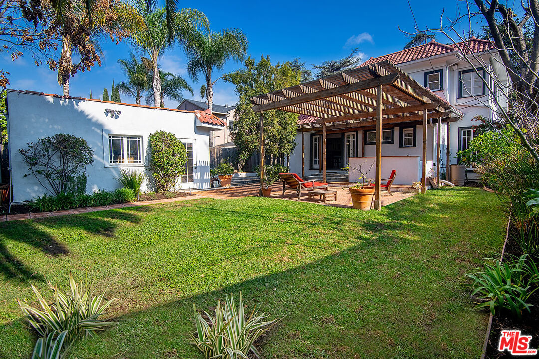 1927 Buckingham Road Los Angeles, CA 90016 - Photo 32 of 36 a view of a house with a yard porch and sitting area