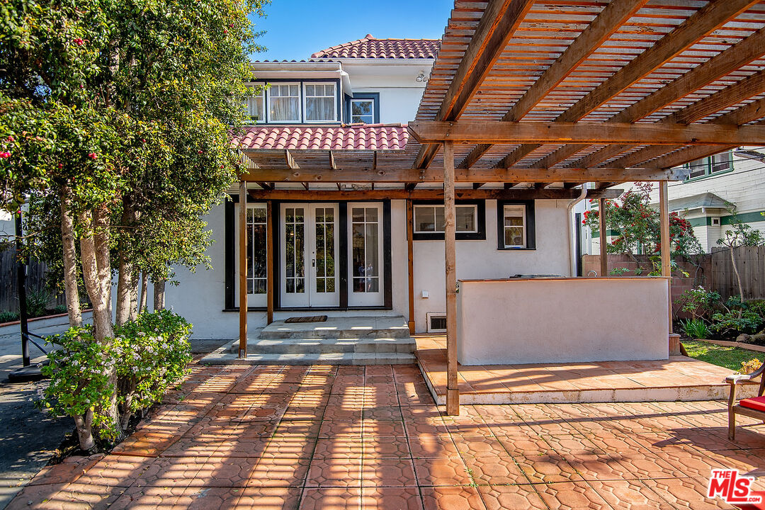 1927 Buckingham Road Los Angeles, CA 90016 - Photo 33 of 36 a view of a building with a porch