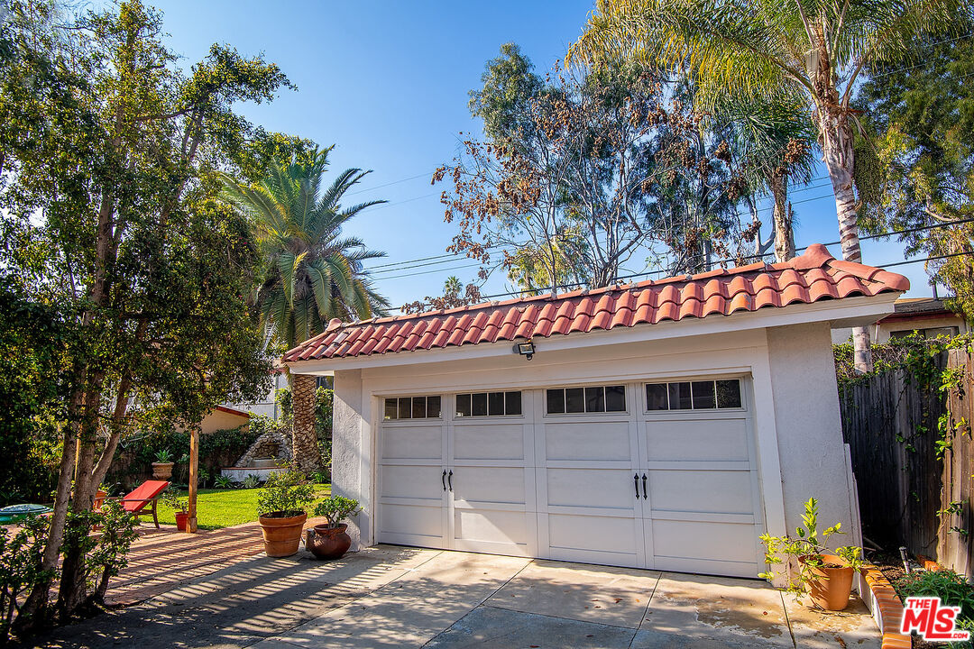 1927 Buckingham Road Los Angeles, CA 90016 - Photo 35 of 36 a view of a house with a garage