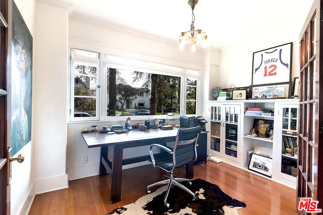 1927 Buckingham Road Los Angeles, CA 90016 - Photo 8 of 36 a view of a workspace with furniture and a potted plant