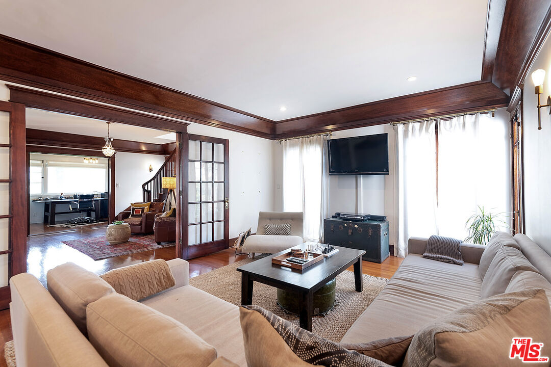 1927 Buckingham Road Los Angeles, CA 90016 - Photo 10 of 36 a living room with furniture and a table