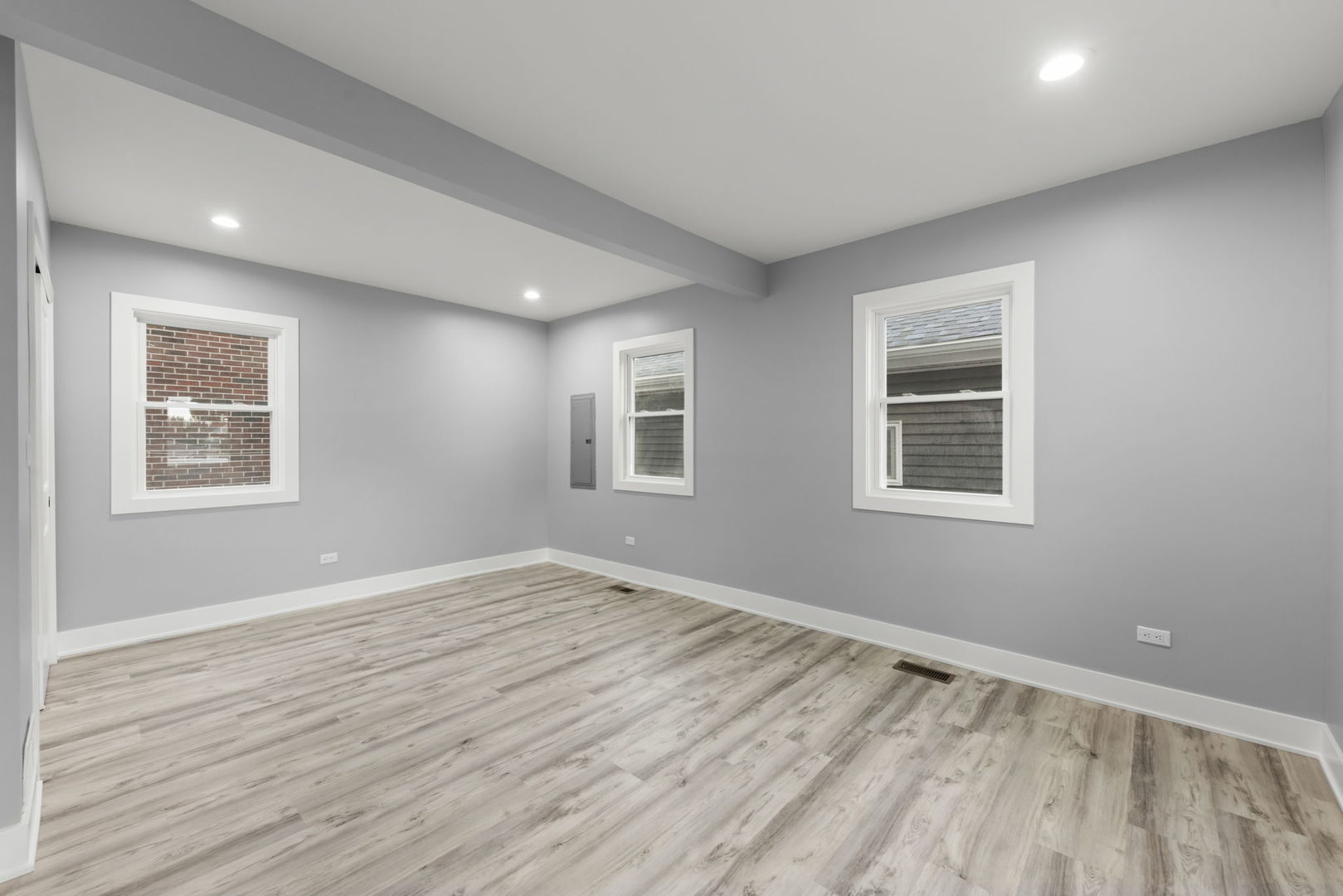 7600 West 60th Street Summit, IL 60501 - Photo 10 of 22 a view of an empty room with wooden floor and a window