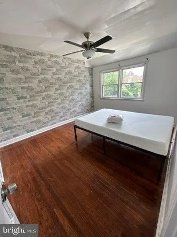 a room with a bed and a window