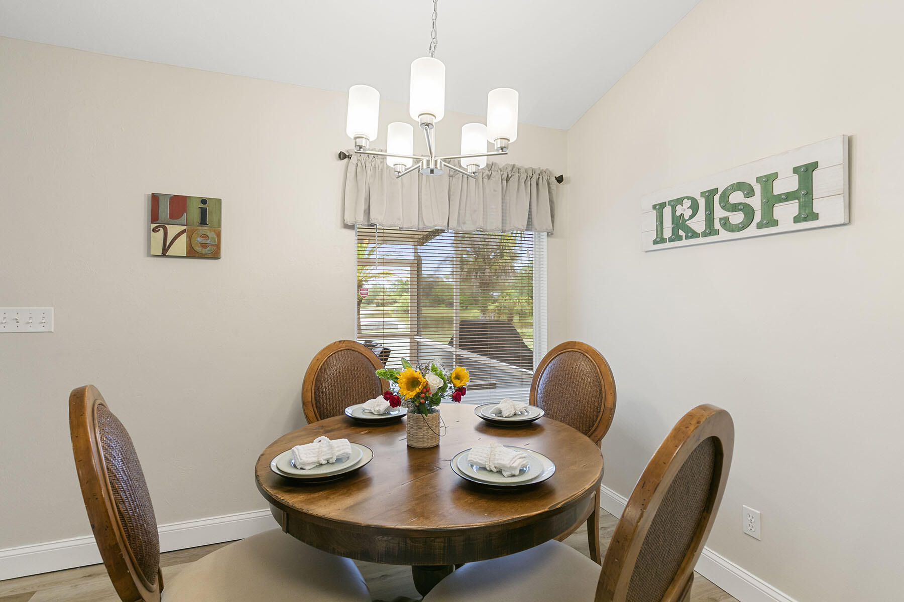 159 Plantation Circle Naples, FL 34104 - Photo 15 of 38 a view of a dining room with furniture and wooden floor
