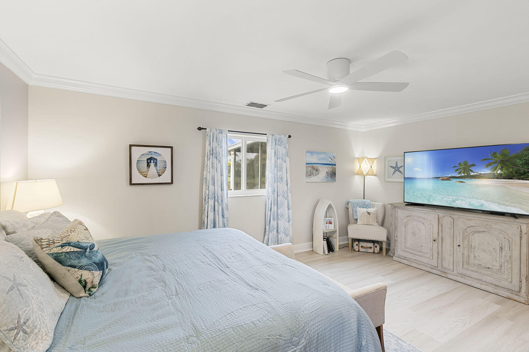 159 Plantation Circle Naples, FL 34104 - Photo 18 of 38 a bedroom with a bed and ceiling fan