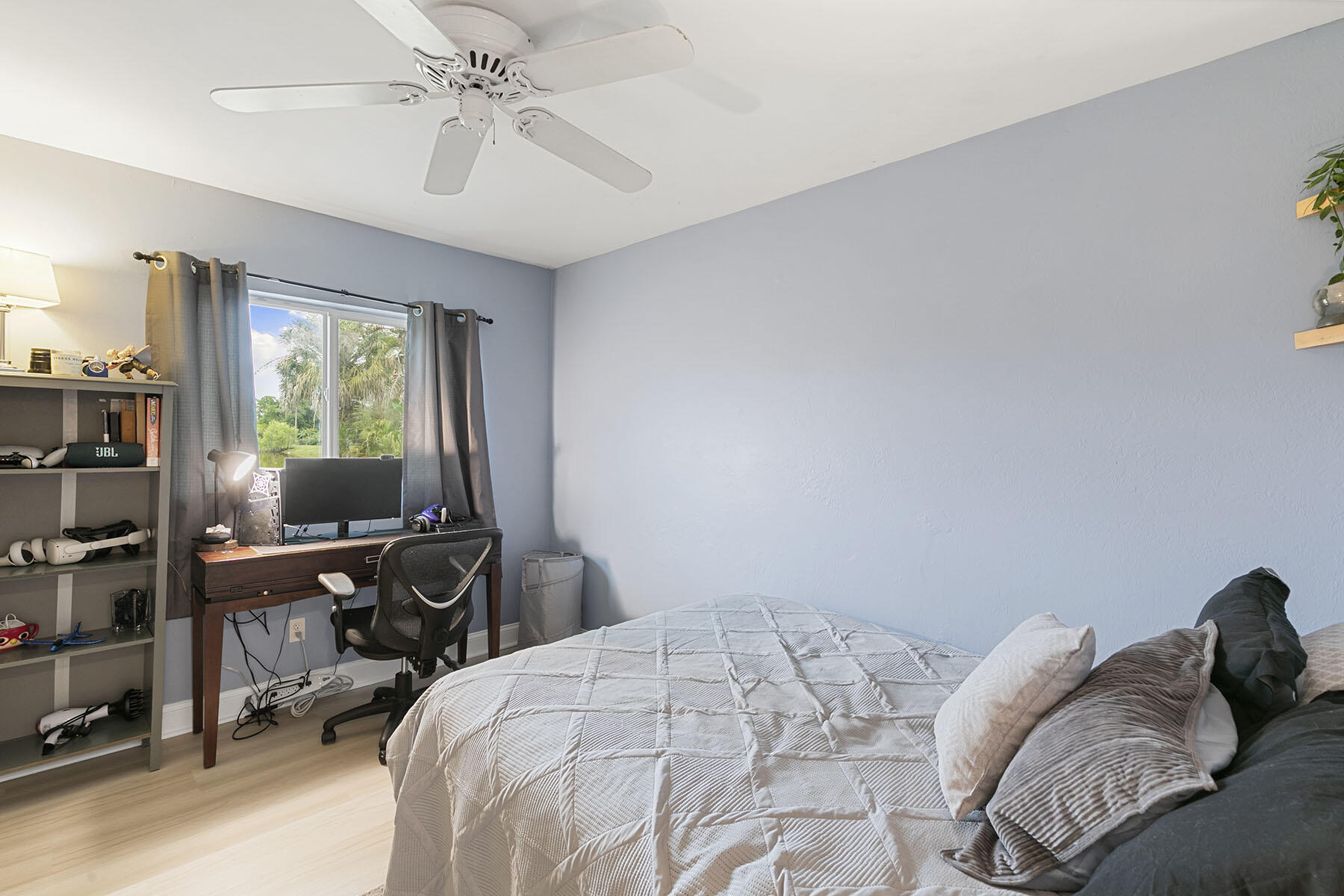 159 Plantation Circle Naples, FL 34104 - Photo 22 of 38 a bedroom with a bed and a chandelier