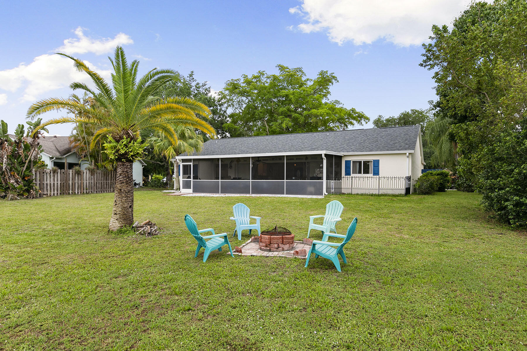 159 Plantation Circle Naples, FL 34104 - Photo 26 of 38 a front view of a house with garden and porch