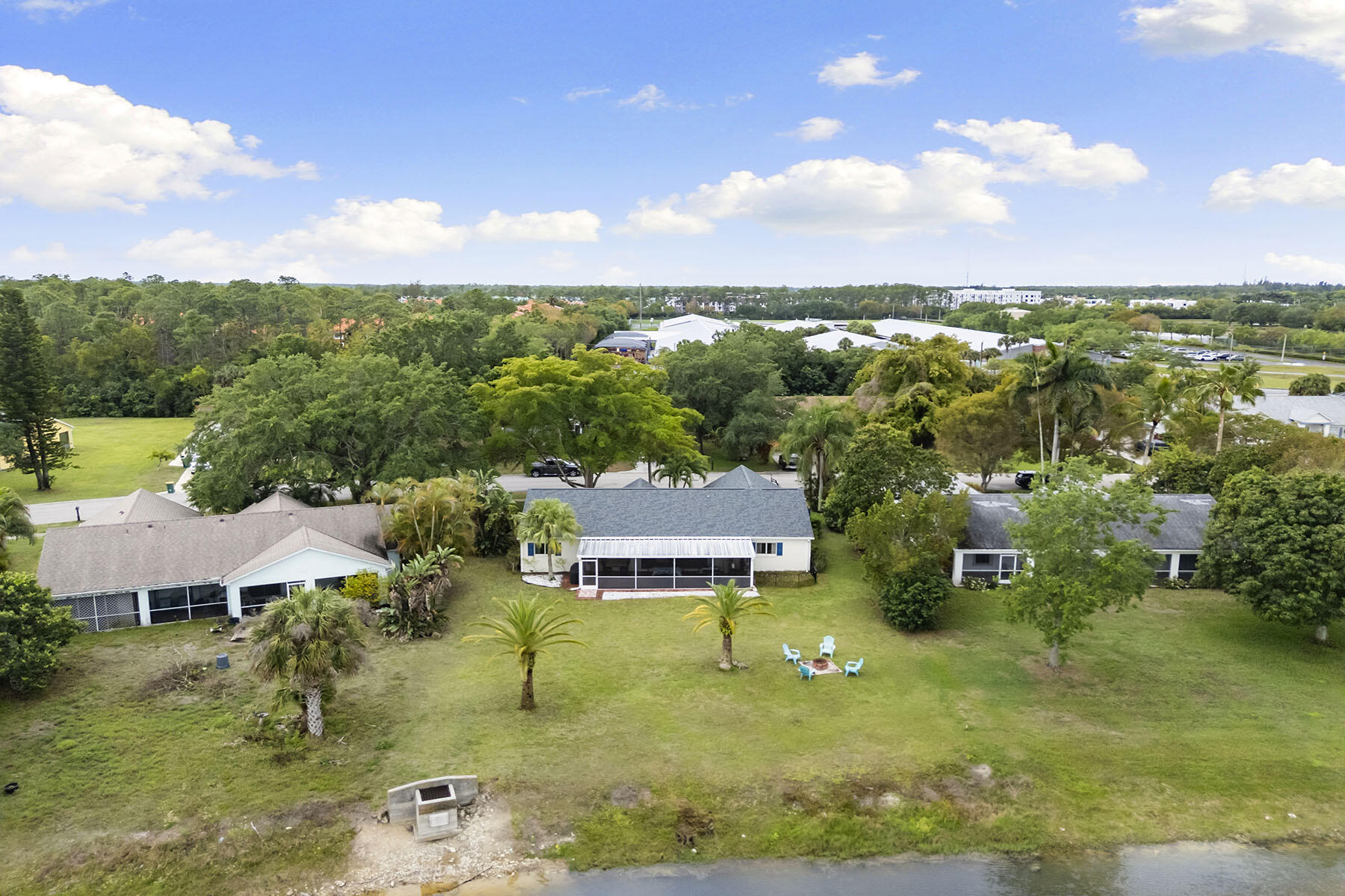 159 Plantation Circle Naples, FL 34104 - Photo 32 of 38 a view of a house with a big yard