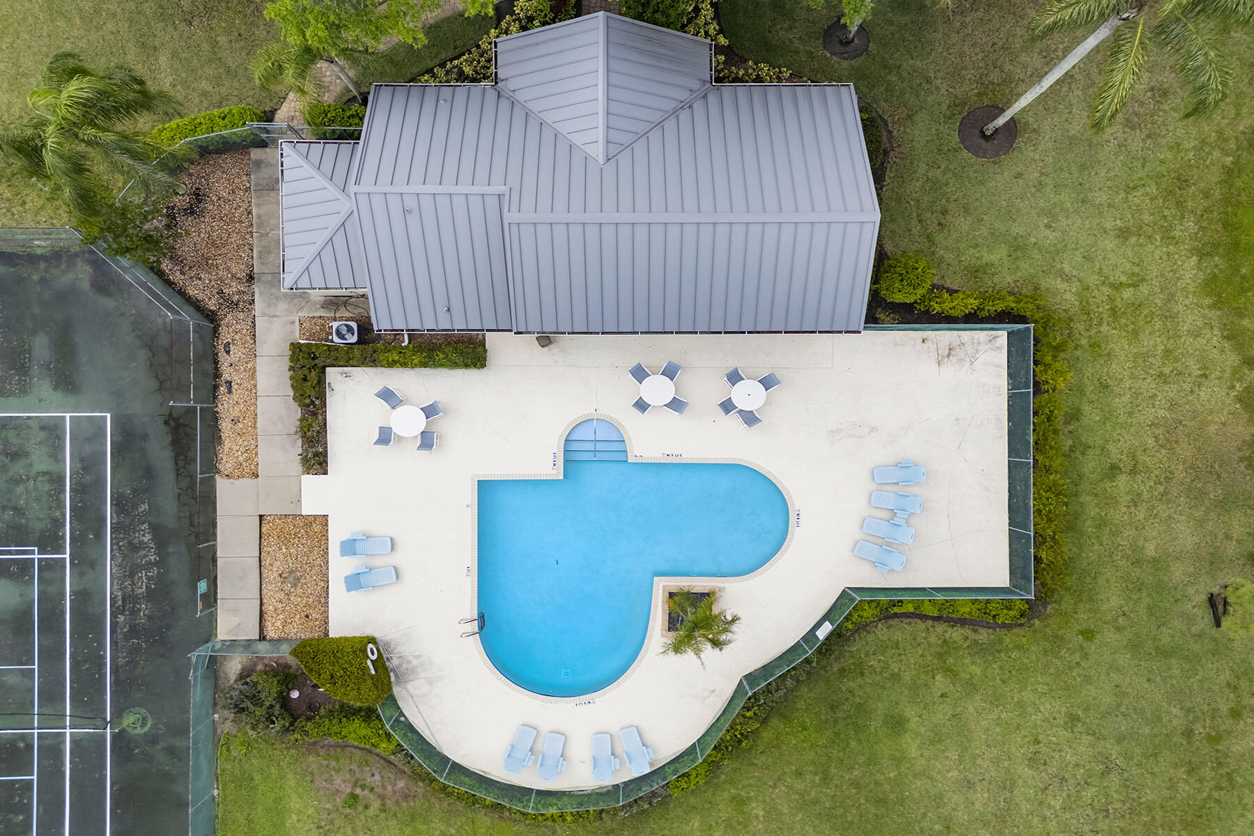 159 Plantation Circle Naples, FL 34104 - Photo 33 of 38 a view of a swimming pool in the backyard