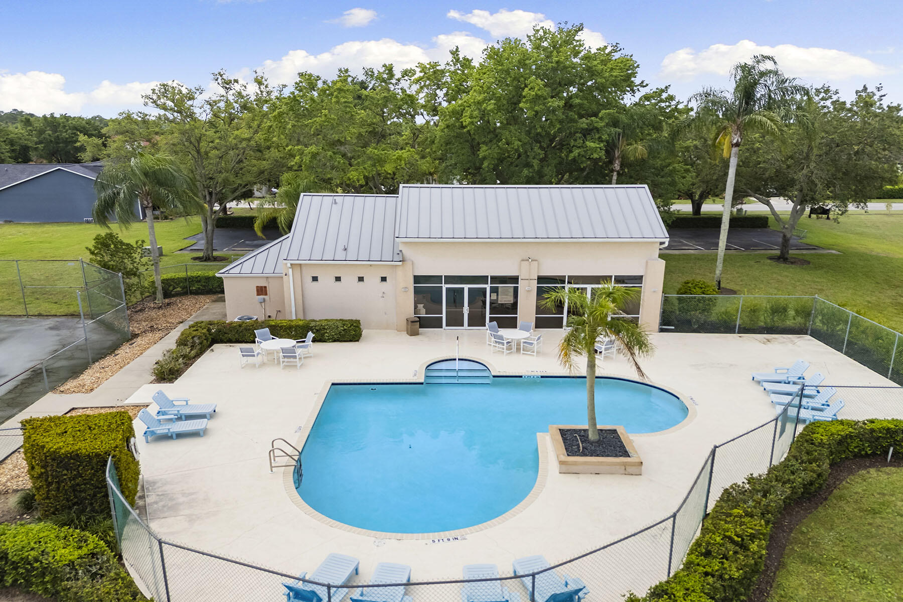 159 Plantation Circle Naples, FL 34104 - Photo 34 of 38 an aerial view of house with swimming pool and garden