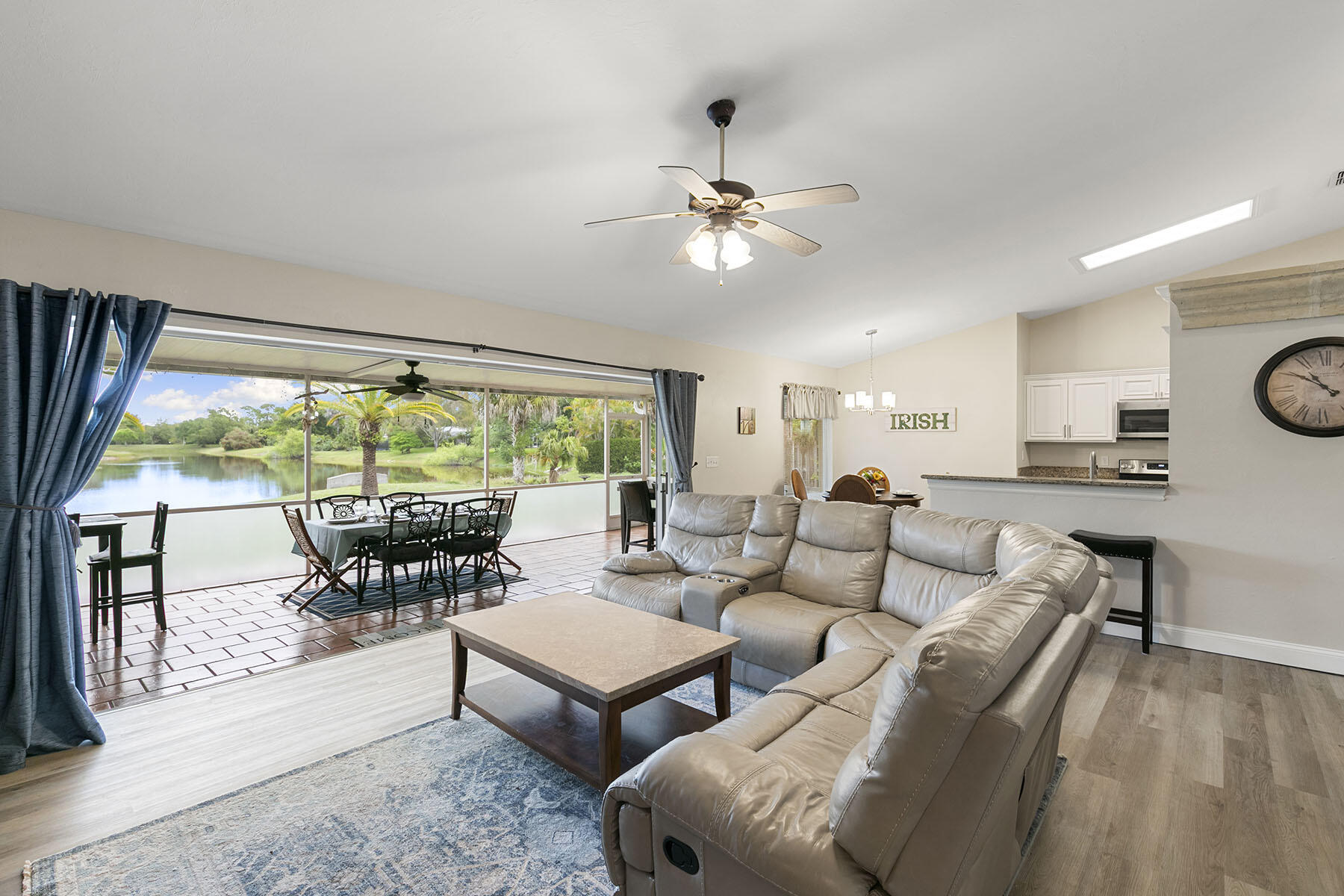 159 Plantation Circle Naples, FL 34104 - Photo 6 of 38 a living room with furniture and a large window