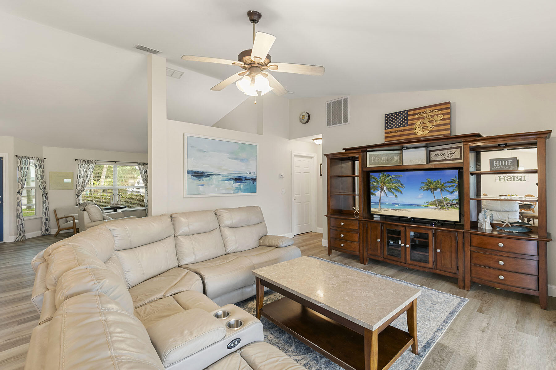 159 Plantation Circle Naples, FL 34104 - Photo 7 of 38 a living room with furniture and a flat screen tv
