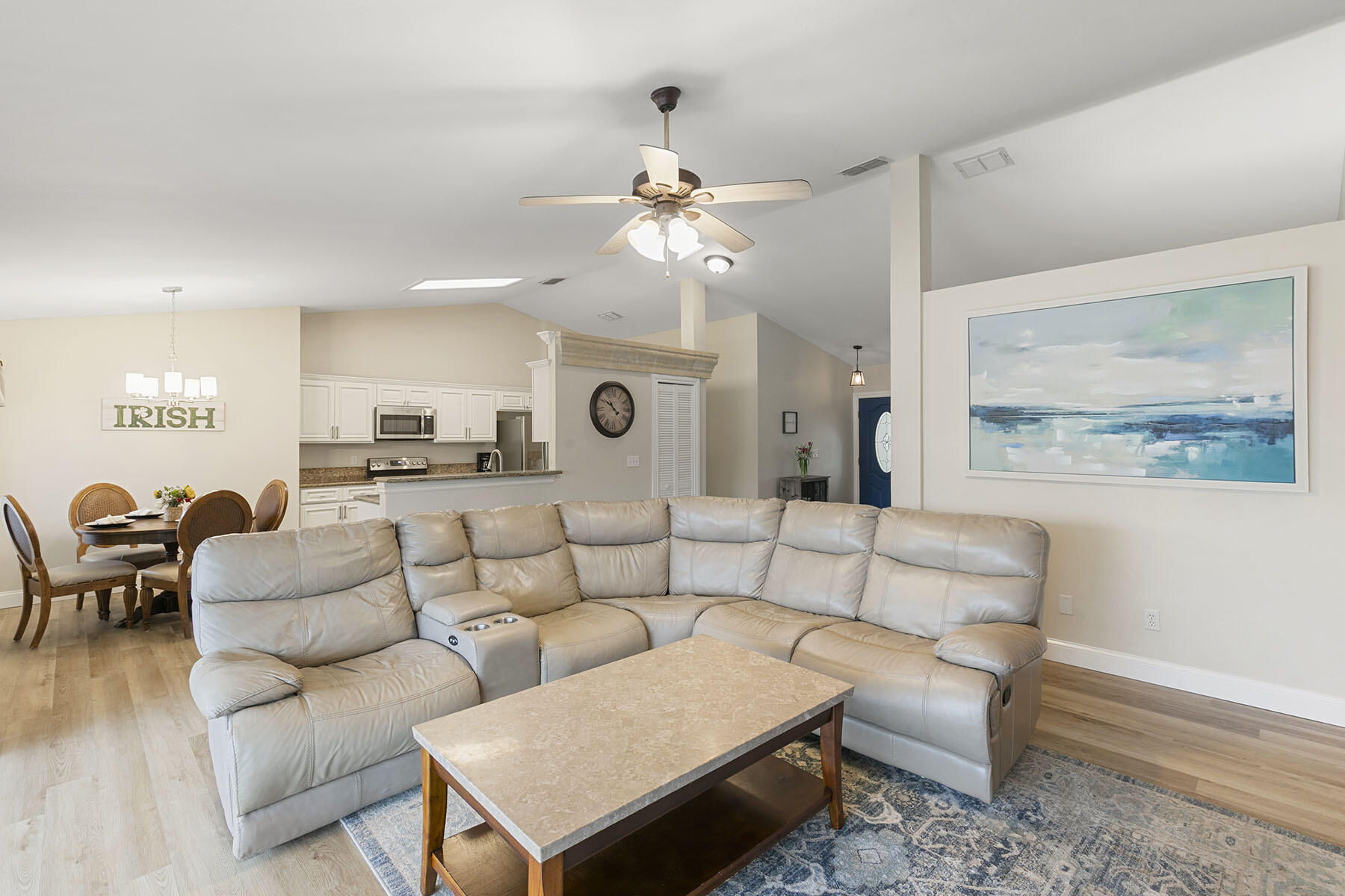 159 Plantation Circle Naples, FL 34104 - Photo 8 of 38 a living room with furniture kitchen view and a chandelier