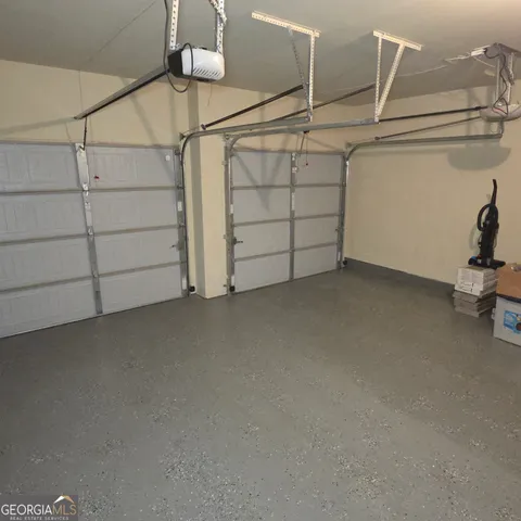 a view of a house with a flower garden