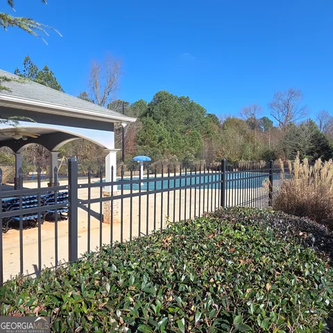 a view of a park with large trees