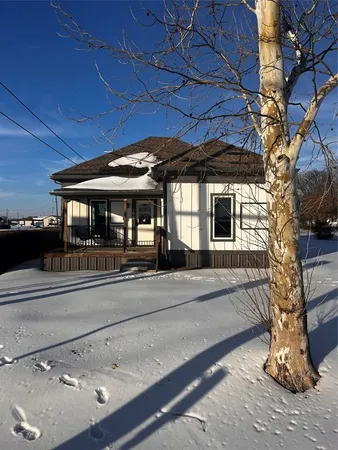 a view of a house with a tree