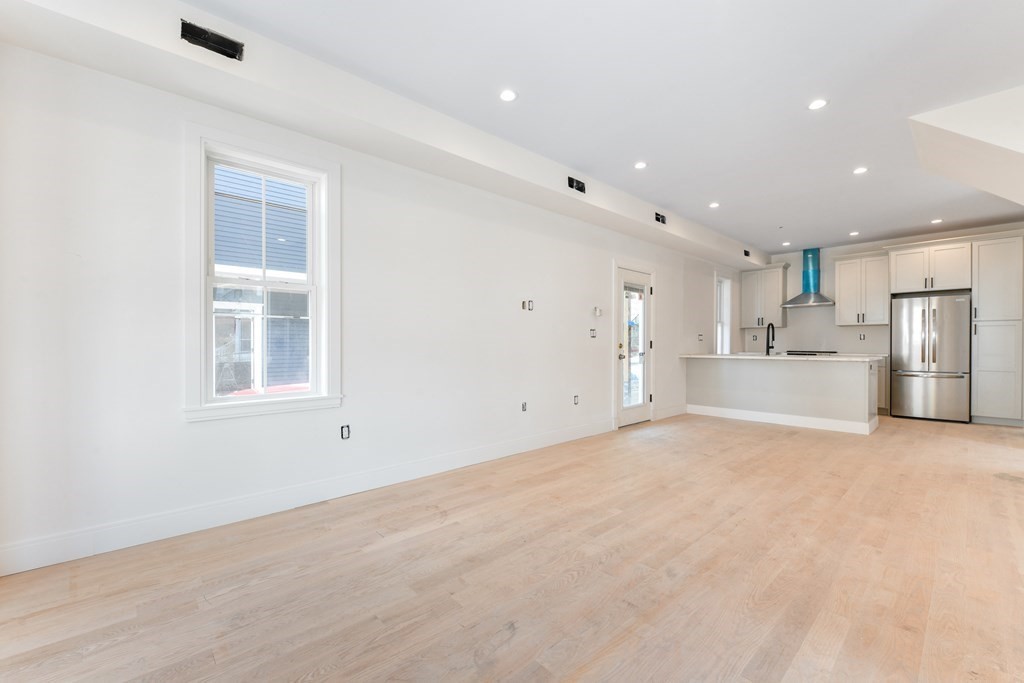 14 Ennis Road, Unit REAR Boston, MA 02119 - Photo 11 of 26 a view of an empty room with a window
