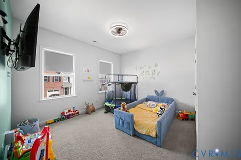 a bedroom with bed and window