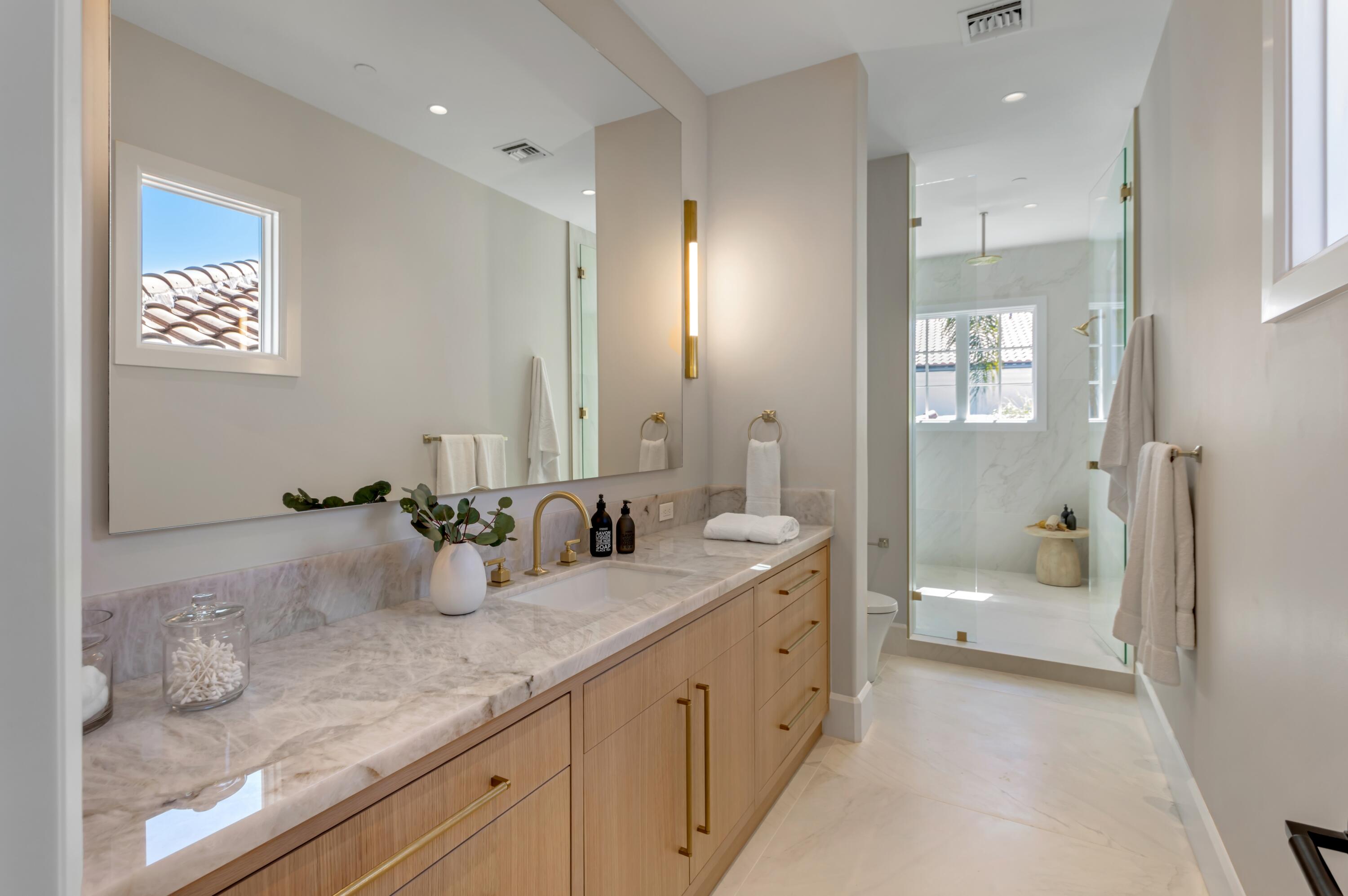 1203 Spanish River Road Boca Raton, FL 33432 - Photo 7 of 30 a bathroom with a granite countertop sink mirror and toilet