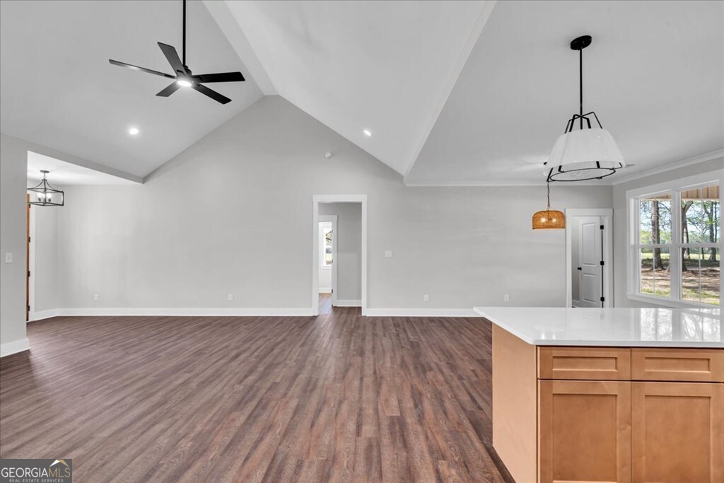 2769 Claxton Dairy Road Dublin, GA 31021 - Photo 15 of 48 a view of empty room with wooden floor and ceiling fan