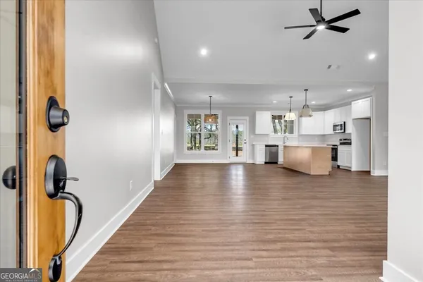 a view of a kitchen with a sink and cabinets