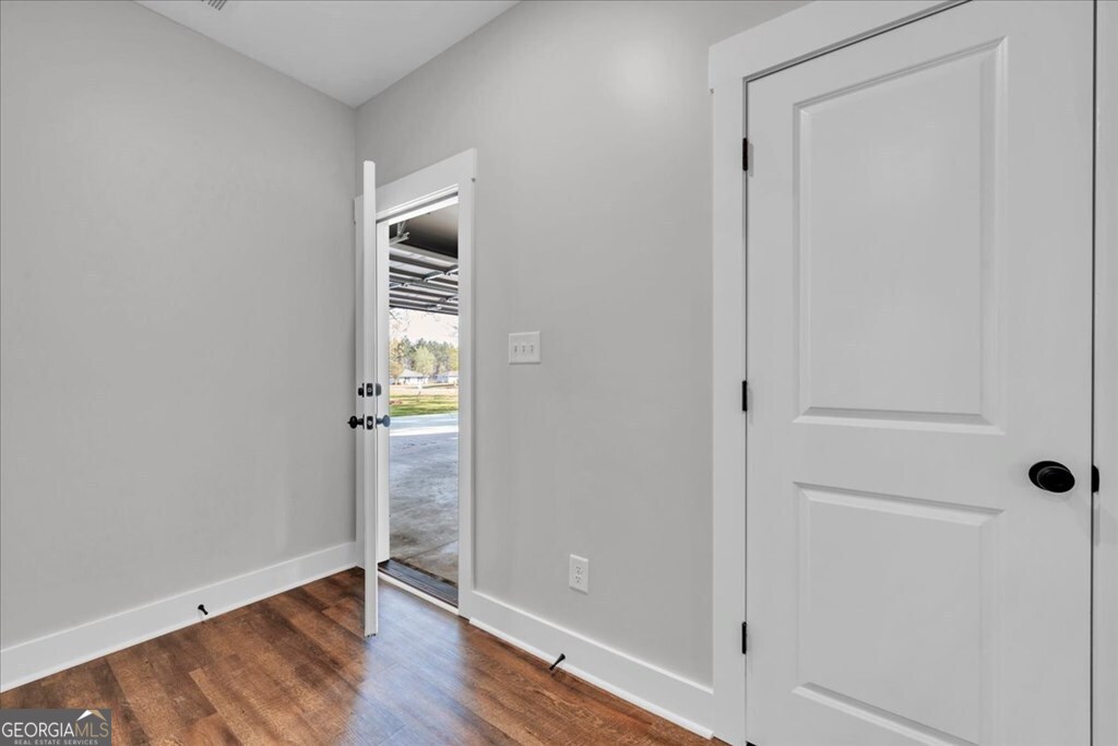 2769 Claxton Dairy Road Dublin, GA 31021 - Photo 28 of 48 a view of empty room with wooden floor