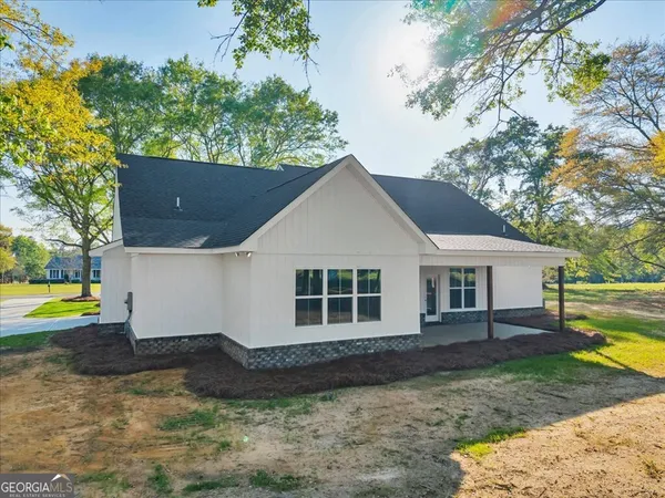 a front view of a house with a yard