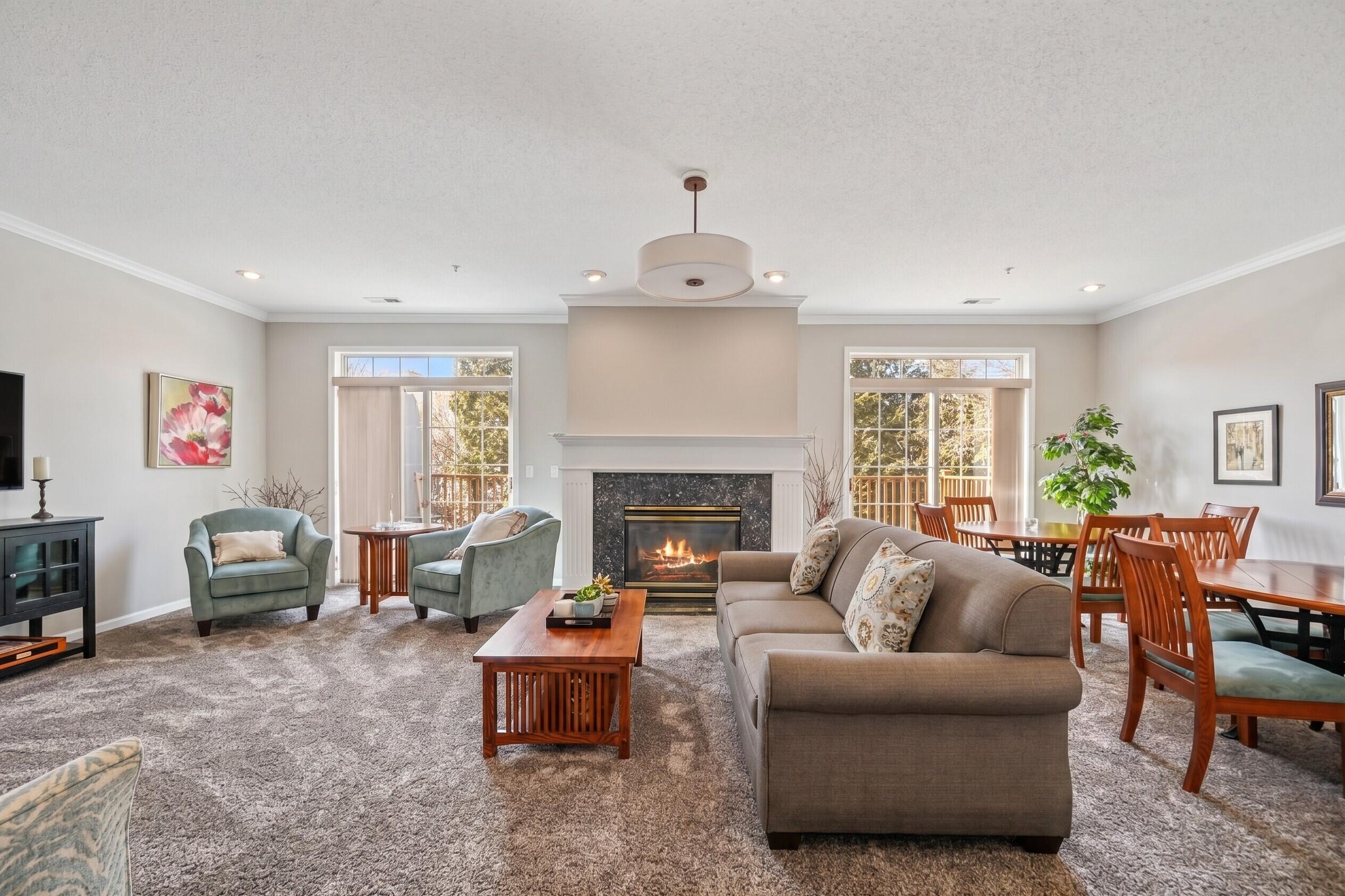 13050 West Bluemound Road, Unit 203 Elm Grove, WI 53122 - Photo 19 of 24 Community room with fireplace and kitchette