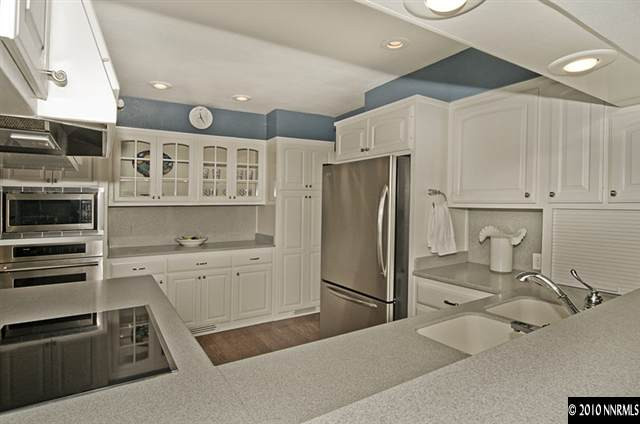 1040 La Rue Avenue Reno, NV 89509 - Photo 8 of 8 a kitchen with a refrigerator sink and cabinets