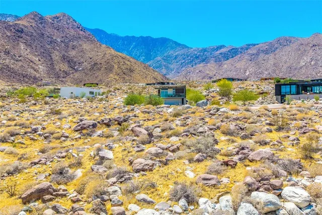 a view of a backyard with sitting area