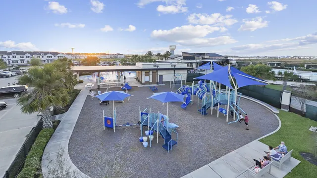 a view of a chairs and table in patio