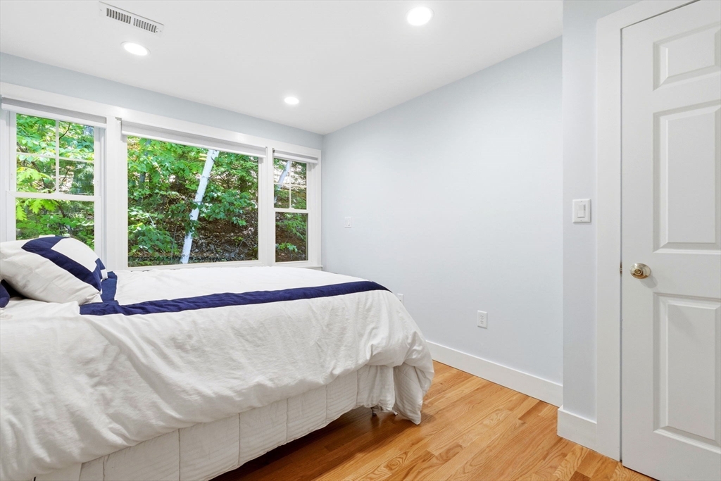 35 Keyes Road Westford, MA 01886 - Photo 25 of 40 a bed sitting in a bedroom next to a window