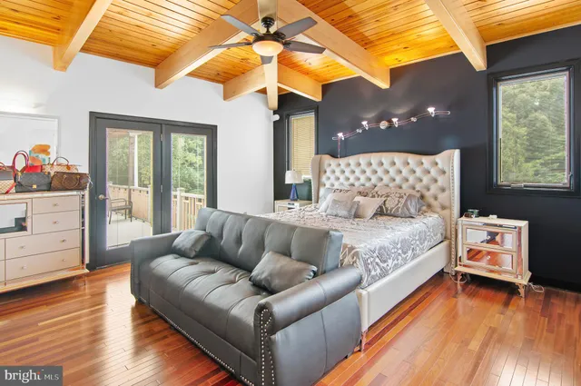 a living room with furniture and flowers