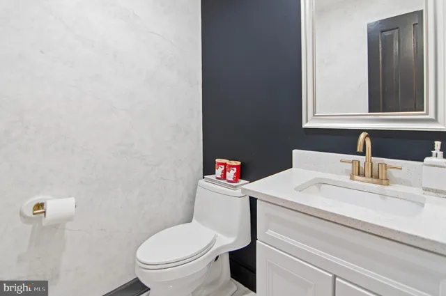 a view of a swimming pool with a lawn chairs under an umbrella