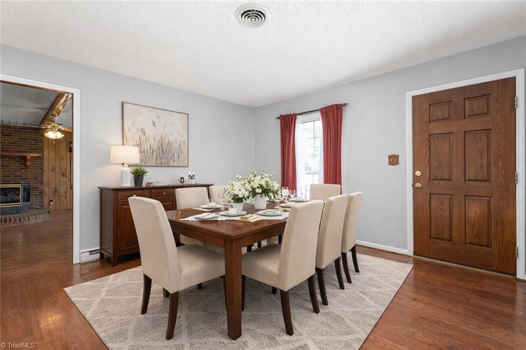 802 Quail Meadow Lane Colfax, NC 27235 - Photo 5 of 38 Virtually staged - Added console, table, chairs and rug.