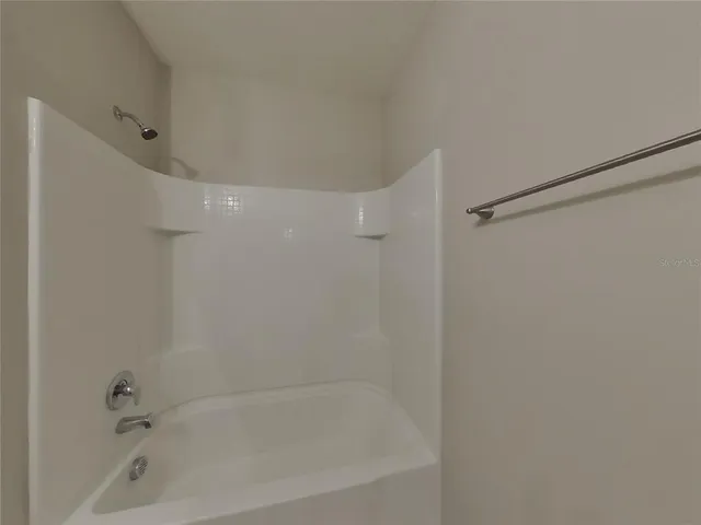 a close view of a bathtub in bathroom