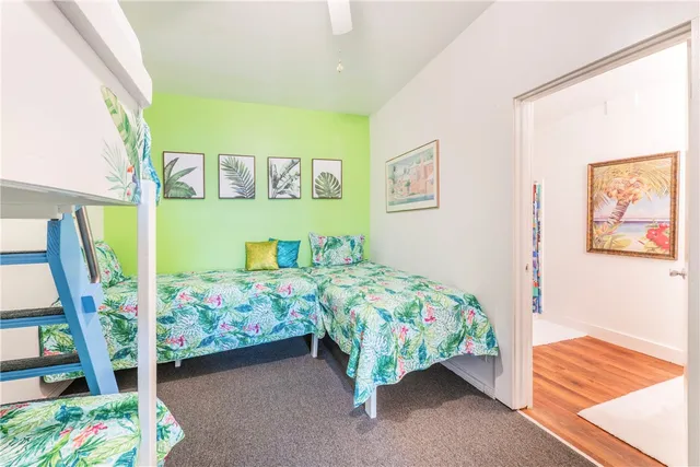 a front view of a house with a garden and pathway