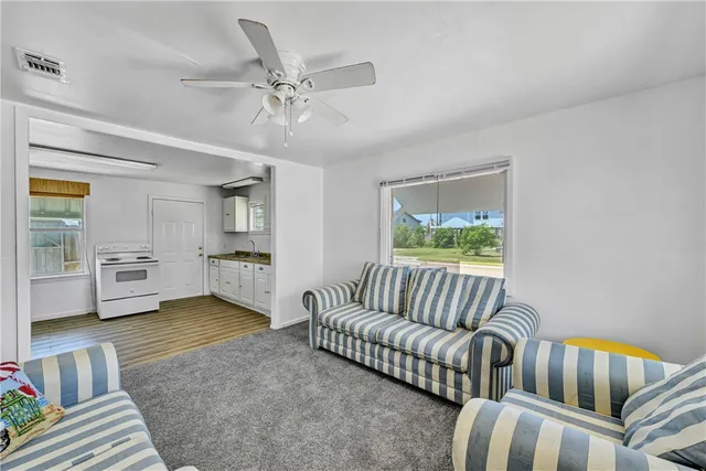 a kitchen with a stove and a wooden cabinets